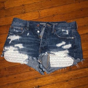 distressed denim shorts with aztec print